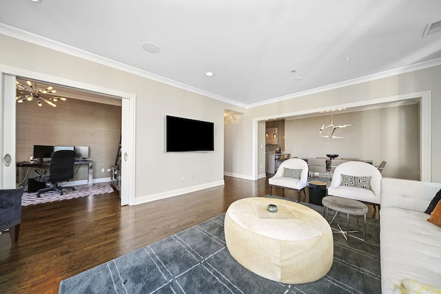 living room featuring visible vents, baseboards, ornamental molding, wood finished floors, and a notable chandelier