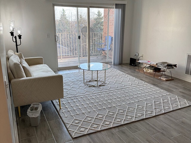 sitting room with wood finish floors and baseboards