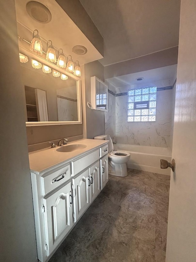 bathroom with toilet, vanity, and shower / bath combination