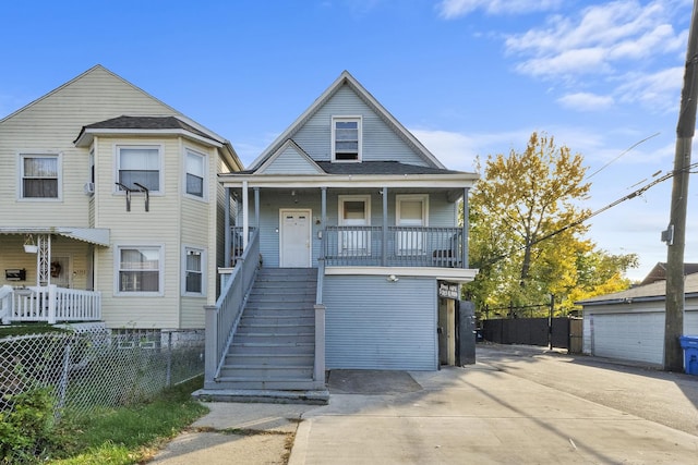 view of front of property featuring stairs, fence, and covered porch