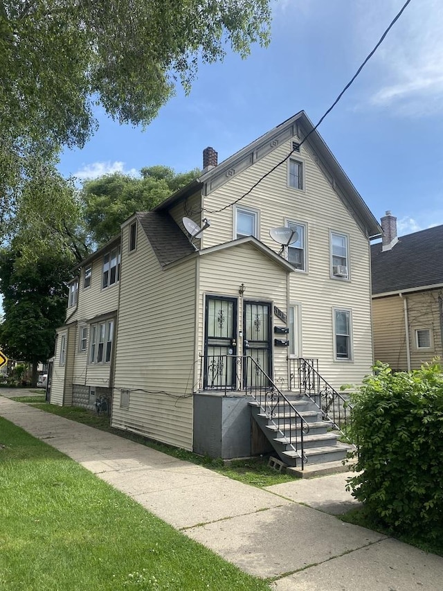 view of front of house with a chimney