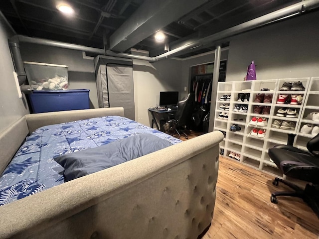 bedroom featuring wood finished floors