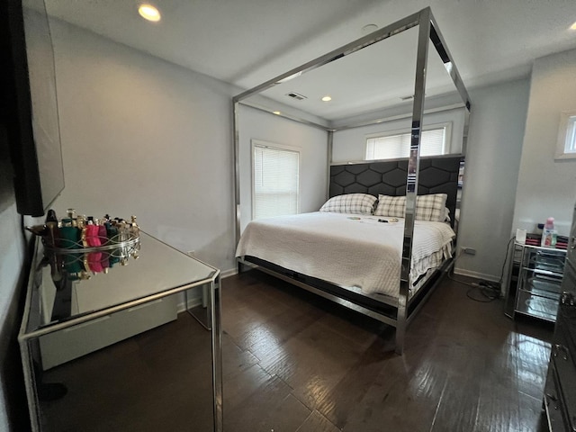 bedroom with recessed lighting, dark wood-style floors, visible vents, and baseboards