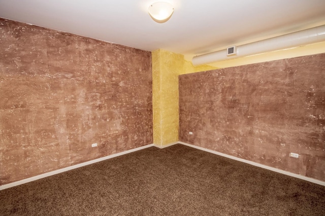 carpeted spare room with baseboards