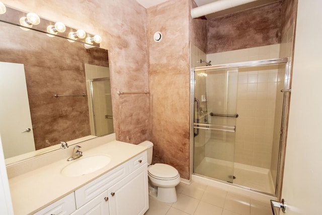 full bath with tile patterned flooring, toilet, vanity, and a stall shower