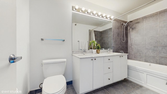 bathroom featuring a sink, toilet, shower / tub combo with curtain, and tile patterned flooring