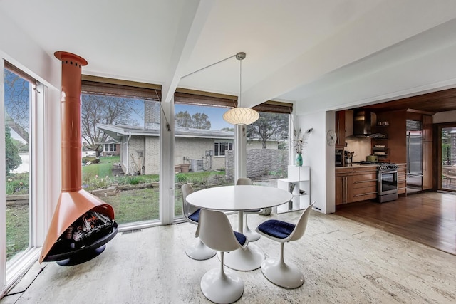 dining room featuring visible vents and wood finished floors