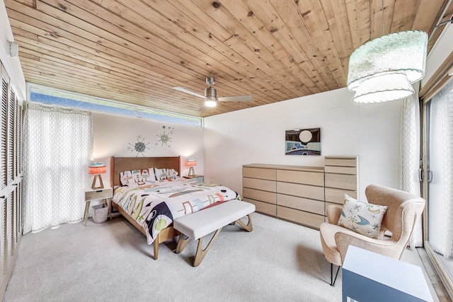 carpeted bedroom with wooden ceiling