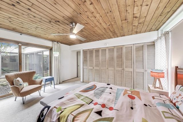 bedroom with light colored carpet, wooden ceiling, and ceiling fan