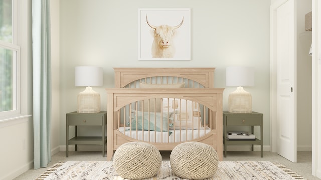 bedroom featuring baseboards and carpet