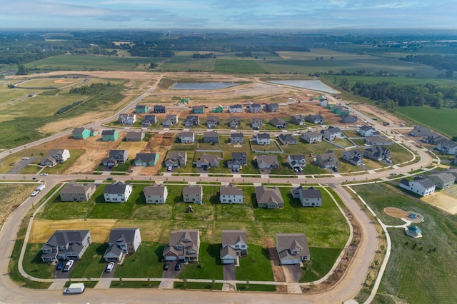 bird's eye view featuring a residential view and a water view