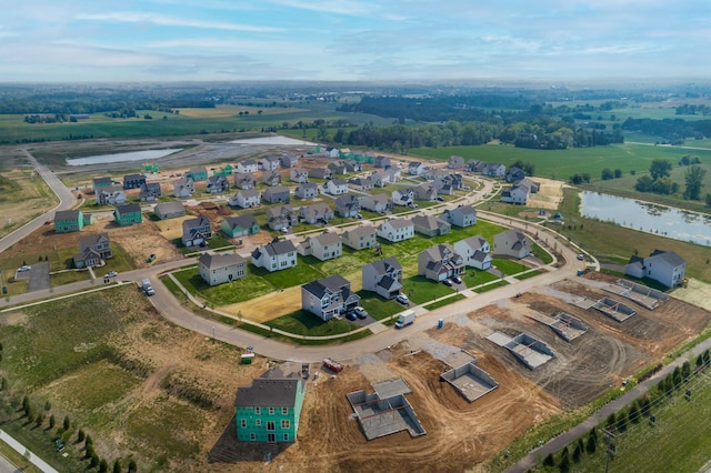 drone / aerial view with a water view and a residential view