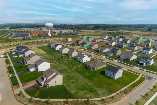 birds eye view of property with a residential view