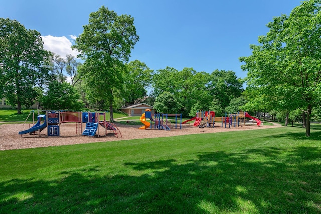 community jungle gym with a lawn