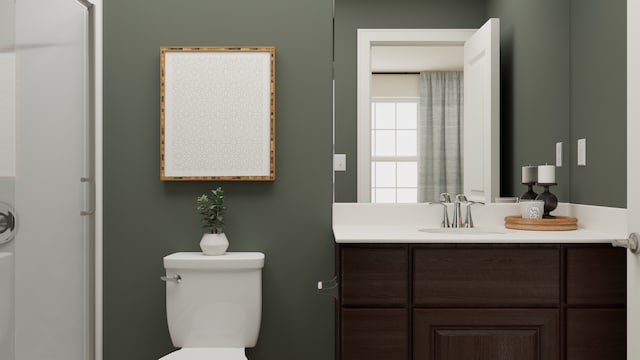 bathroom with toilet and vanity