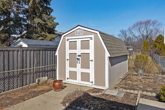 view of shed with a fenced backyard