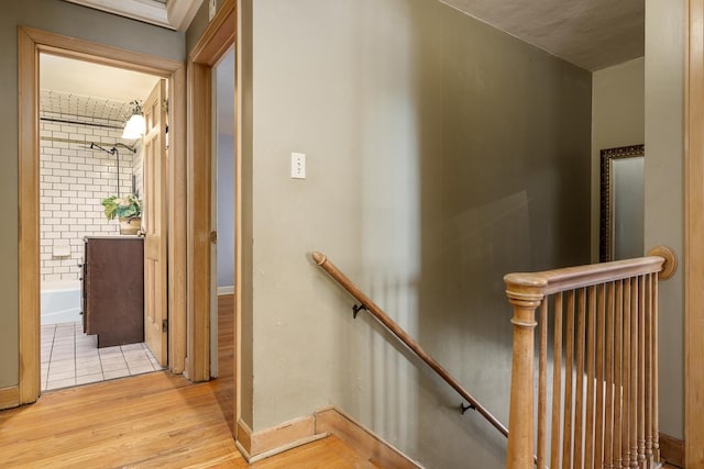 stairway featuring wood finished floors