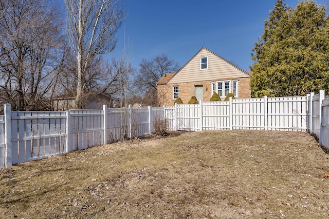 view of yard with a fenced backyard