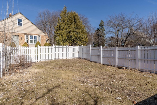 view of yard featuring a fenced backyard