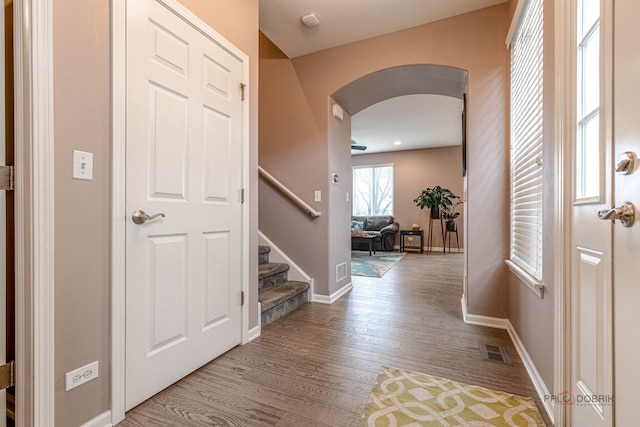 655 N Fox Trl, Round Lake, IL 60073 - entrance foyer with arched walkways, light wood-style flooring, stairs, and baseboards
