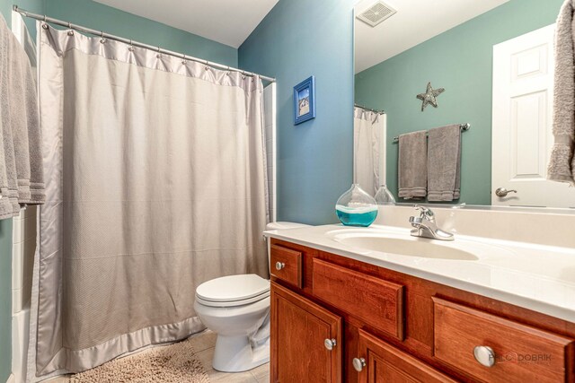 655 N Fox Trl, Round Lake, IL 60073 - full bath with toilet, tile patterned floors, vanity, and a shower with shower curtain