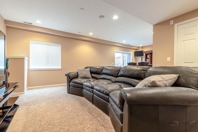 655 N Fox Trl, Round Lake, IL 60073 - living area featuring dark colored carpet, recessed lighting, baseboards, and healthy amount of natural light