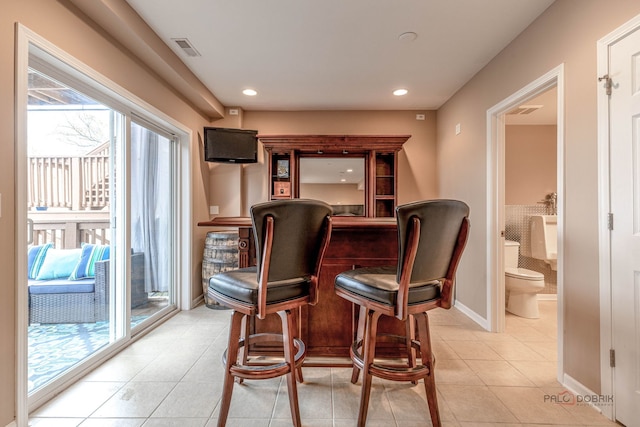 655 N Fox Trl, Round Lake, IL 60073 - indoor dry bar featuring light tile patterned floors, baseboards, and recessed lighting