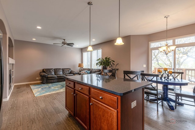 655 N Fox Trl, Round Lake, IL 60073 - kitchen with healthy amount of natural light, a chandelier, dark wood-type flooring, a ceiling fan, and recessed lighting