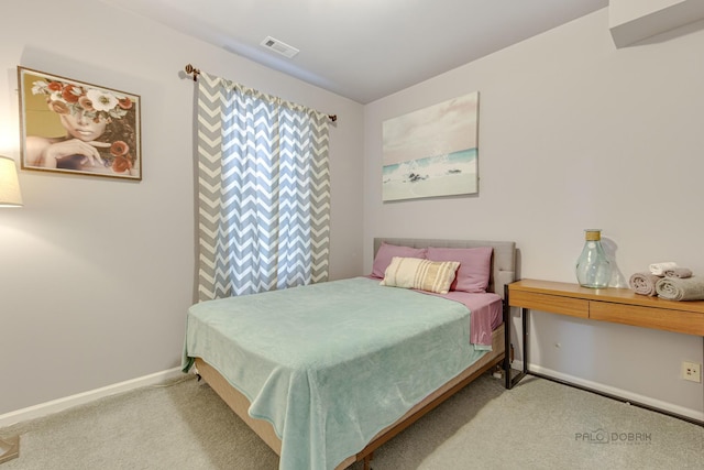 bedroom with carpet, visible vents, and baseboards