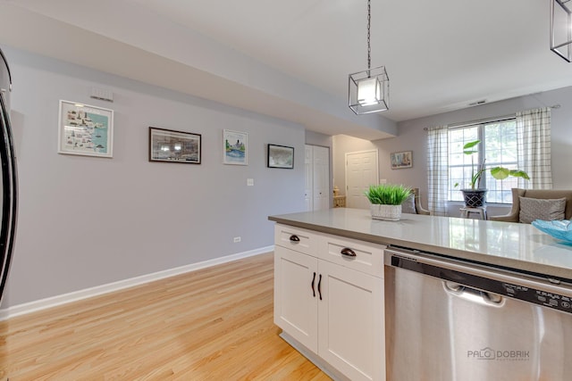 kitchen featuring light wood finished floors, baseboards, dishwasher, pendant lighting, and white cabinets