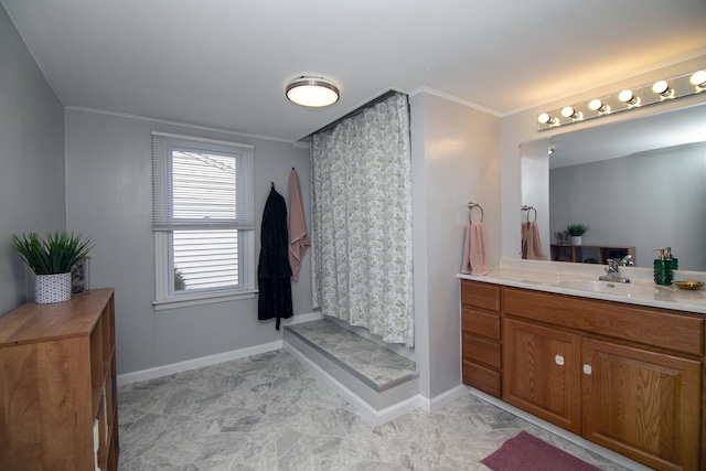 full bathroom featuring a shower with shower curtain, vanity, crown molding, and baseboards