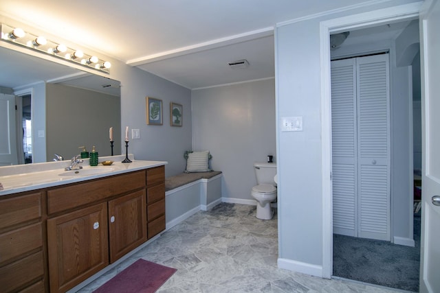 bathroom with visible vents, baseboards, toilet, a closet, and vanity