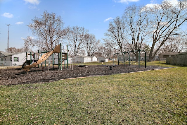 view of yard with playground community and fence