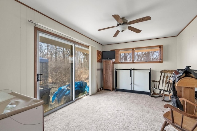 living area with light carpet, crown molding, and ceiling fan