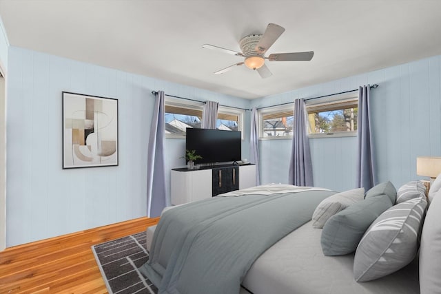 bedroom with wood finished floors and a ceiling fan