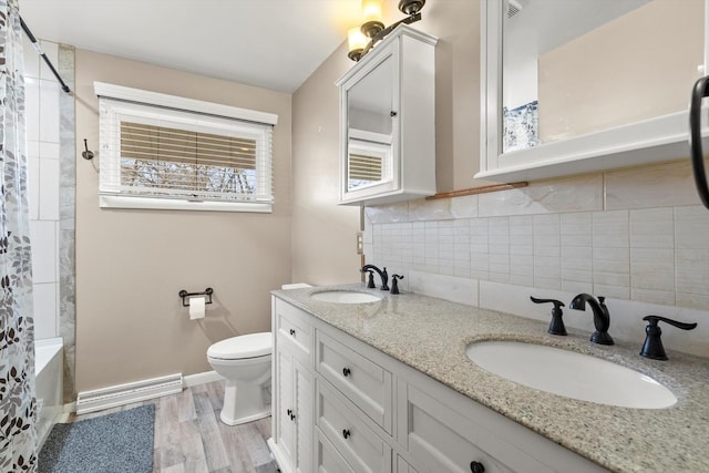 full bath featuring a sink, visible vents, toilet, and decorative backsplash