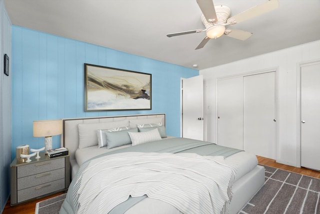 bedroom featuring a closet, a ceiling fan, and wood finished floors