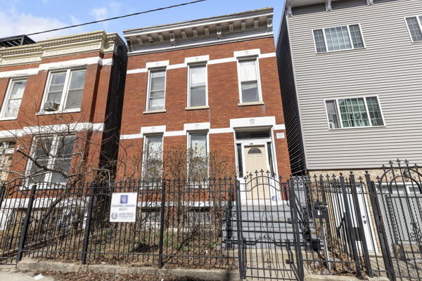 2016 W Superior St, Chicago, IL 60612 - view of property with brick siding, a gate, and a fenced front yard