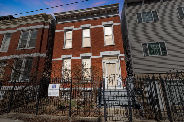 2016 W Superior St, Chicago, IL 60612 - view of property featuring brick siding, a gate, and a fenced front yard