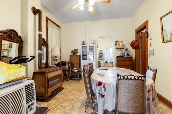 2016 W Superior St, Chicago, IL 60612 - dining space with a wall unit AC, arched walkways, and ceiling fan