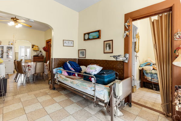 2016 W Superior St, Chicago, IL 60612 - sitting room featuring arched walkways, a ceiling fan, and light tile patterned flooring