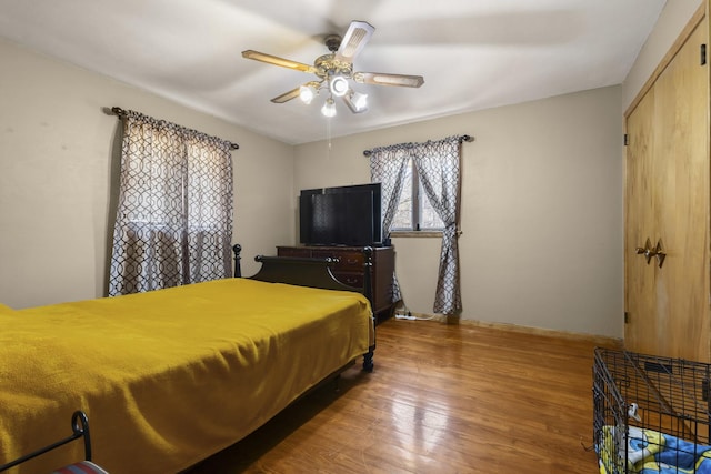 bedroom featuring ceiling fan and wood finished floors
