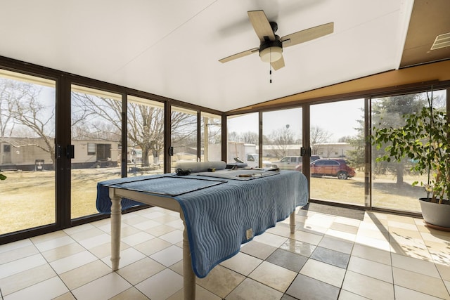 sunroom with vaulted ceiling and ceiling fan