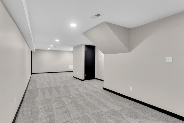 interior space with recessed lighting, visible vents, baseboards, and light carpet