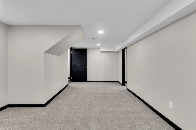 interior space featuring light carpet, visible vents, recessed lighting, and baseboards