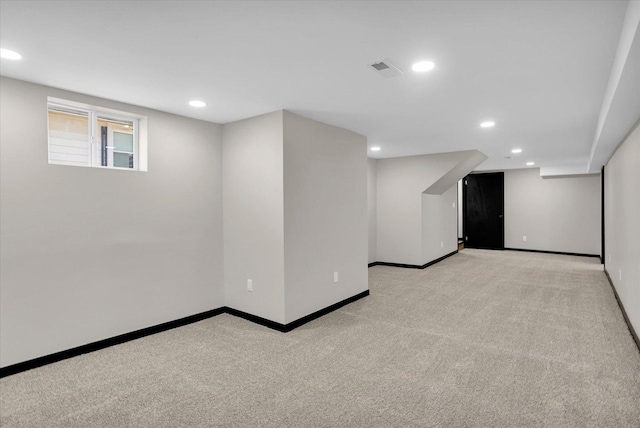 below grade area with carpet flooring, recessed lighting, and baseboards