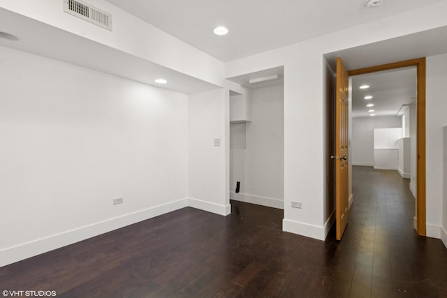 unfurnished bedroom featuring dark wood-style floors, visible vents, recessed lighting, and baseboards