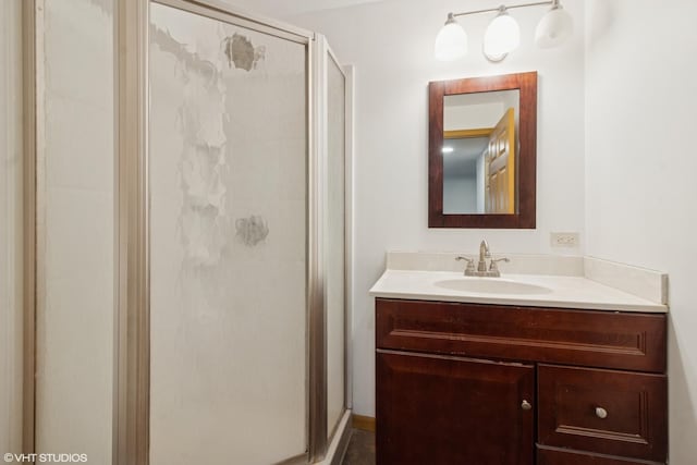 bathroom featuring a stall shower and vanity