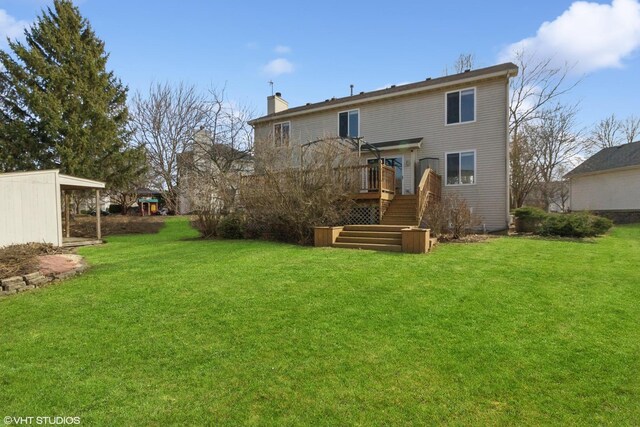 back of house with a deck, a chimney, stairs, and a yard