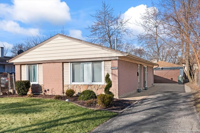 16340 Justine St, Markham, IL 60428 - view of side of home featuring brick siding, an outdoor structure, and a yard
